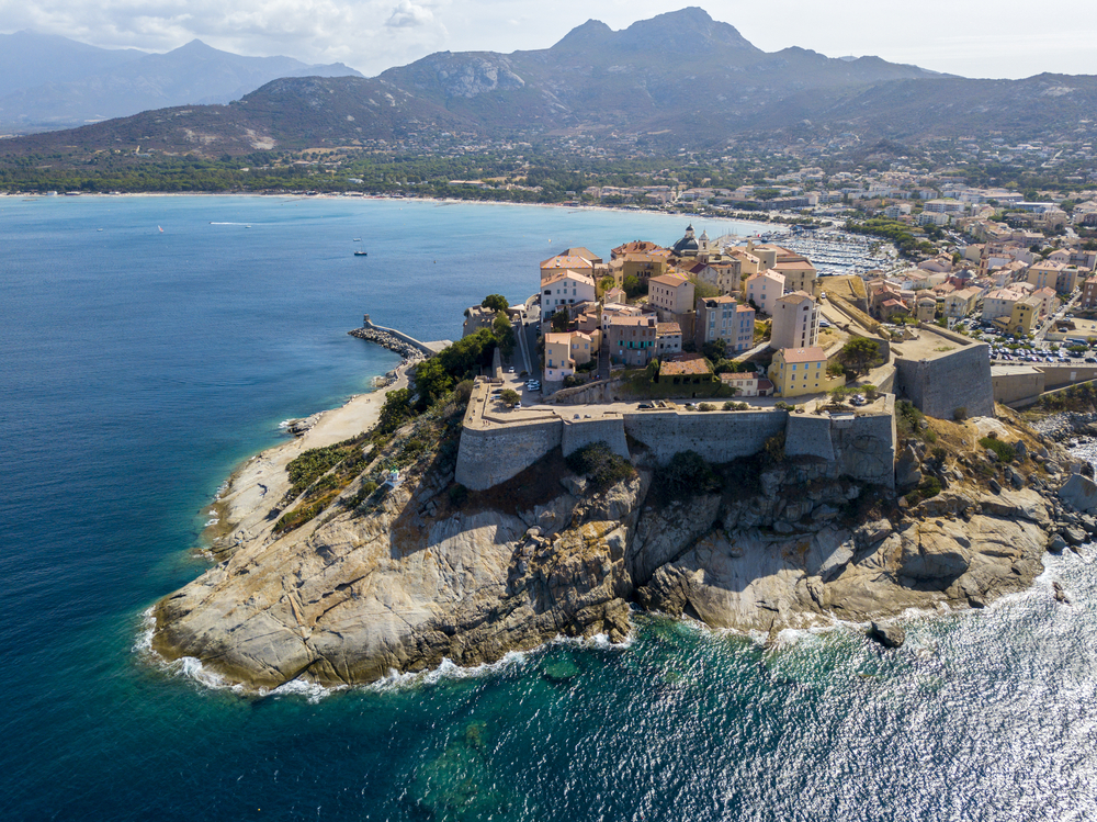 Aerial view of Calvi city, Corsica, France. Walls of the city, cliff overlooking the sea
